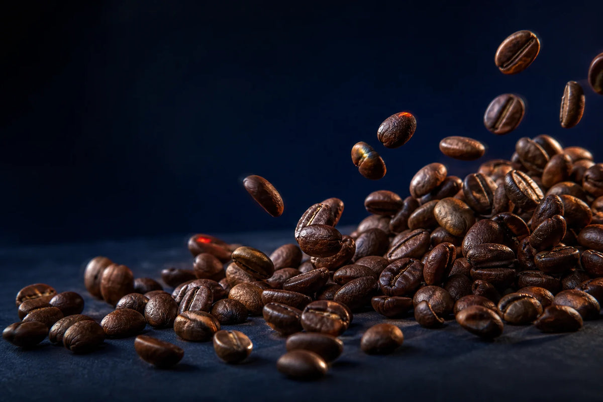 Macro of whole roasted coffee beans in motion