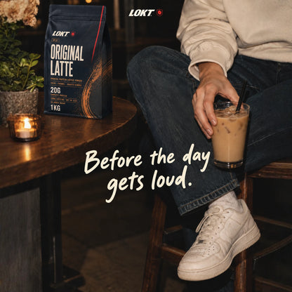 LOKT MIX Original Latte bag on a café table beside an iced latte, headline Before the day gets loud.