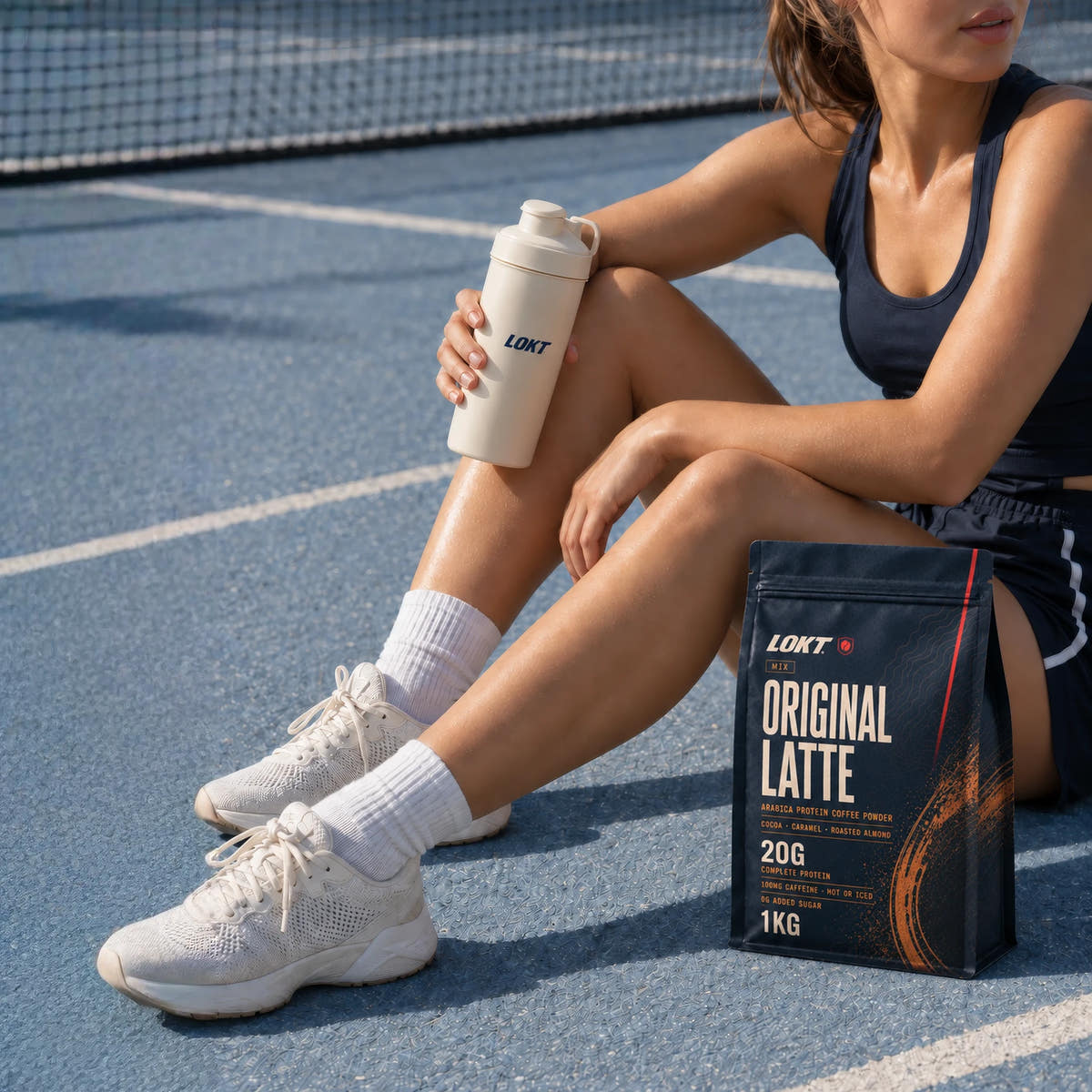 LOKT Original Latte protein coffee bag beside a woman resting on a blue court