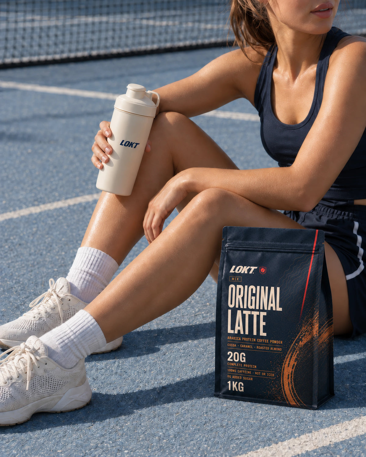 LOKT Original Latte protein coffee bag beside a woman resting on a blue court