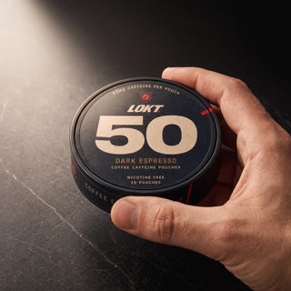 A LOKT 50 Dark Espresso can held in one hand, its lid printed 20 POUCHES