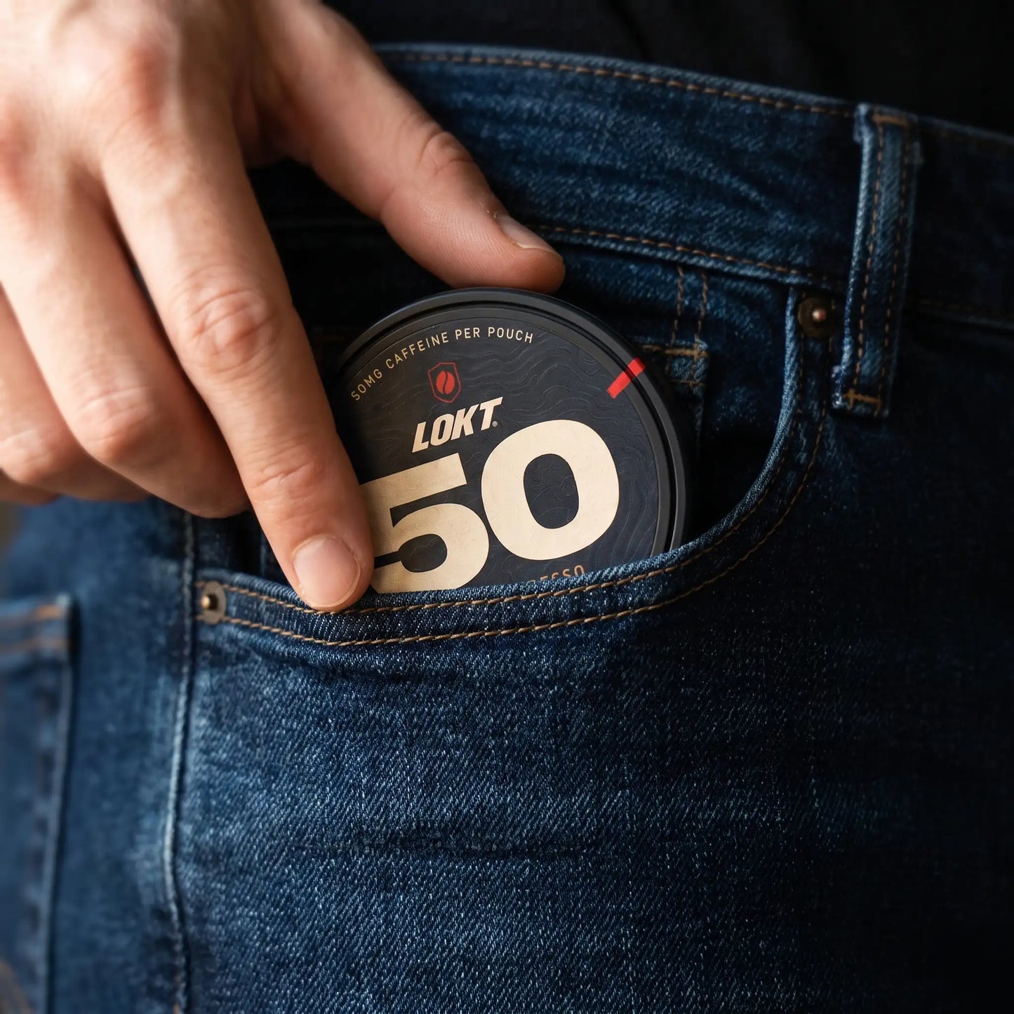 A LOKT 50 can slipped into the coin pocket of a pair of jeans