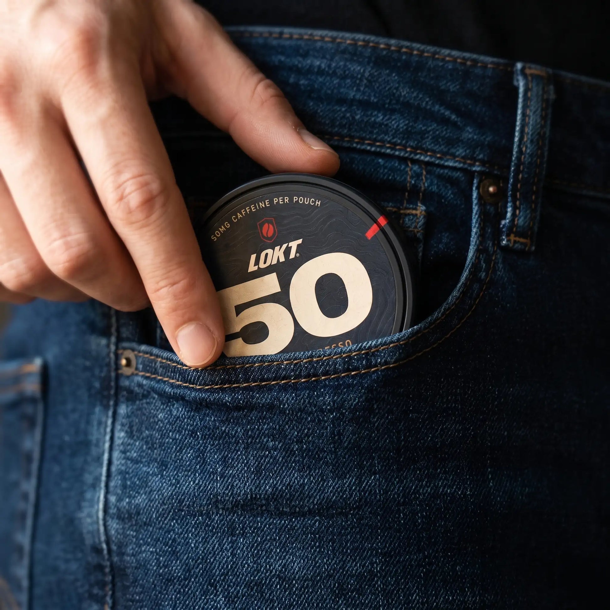 A LOKT 50 can slipped into the coin pocket of a pair of jeans