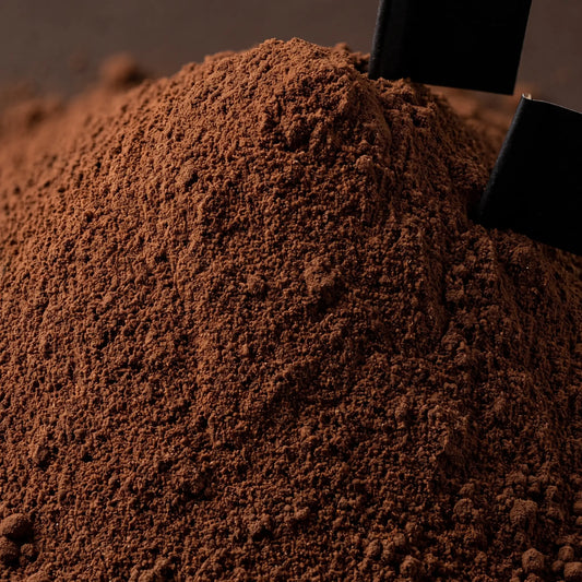 Close macro of LOKT MIX Dark Mocha protein coffee powder, showing the grind