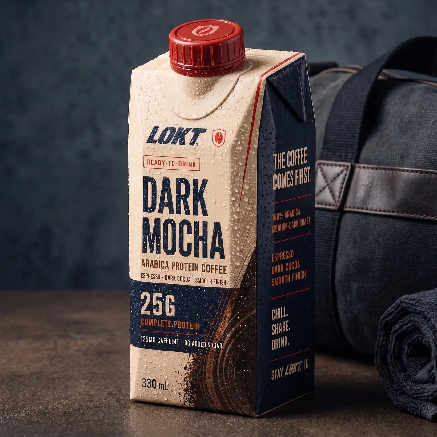 A LOKT READY Dark Mocha carton beside a gym bag after training