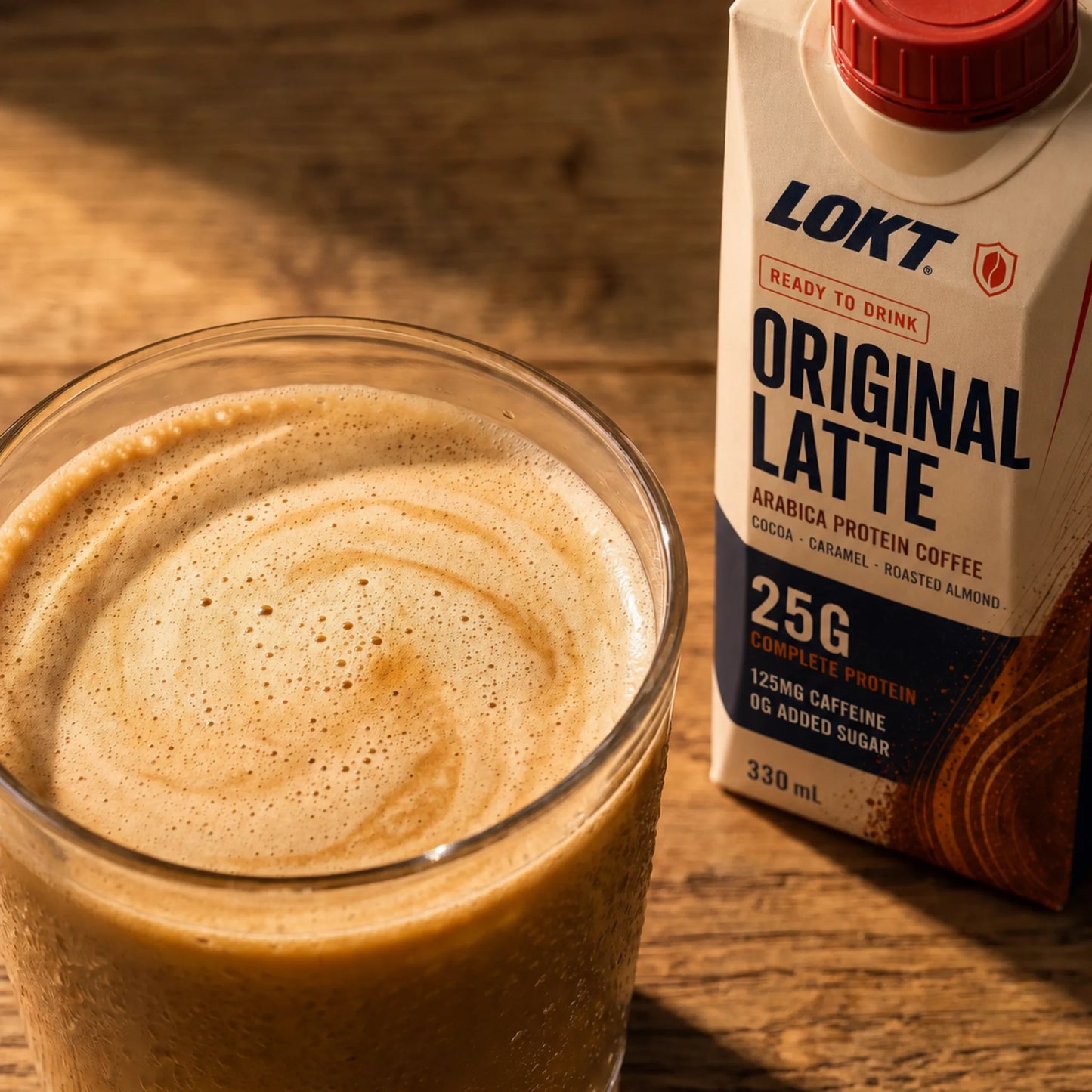 Macro texture of poured LOKT READY Original Latte beside the carton