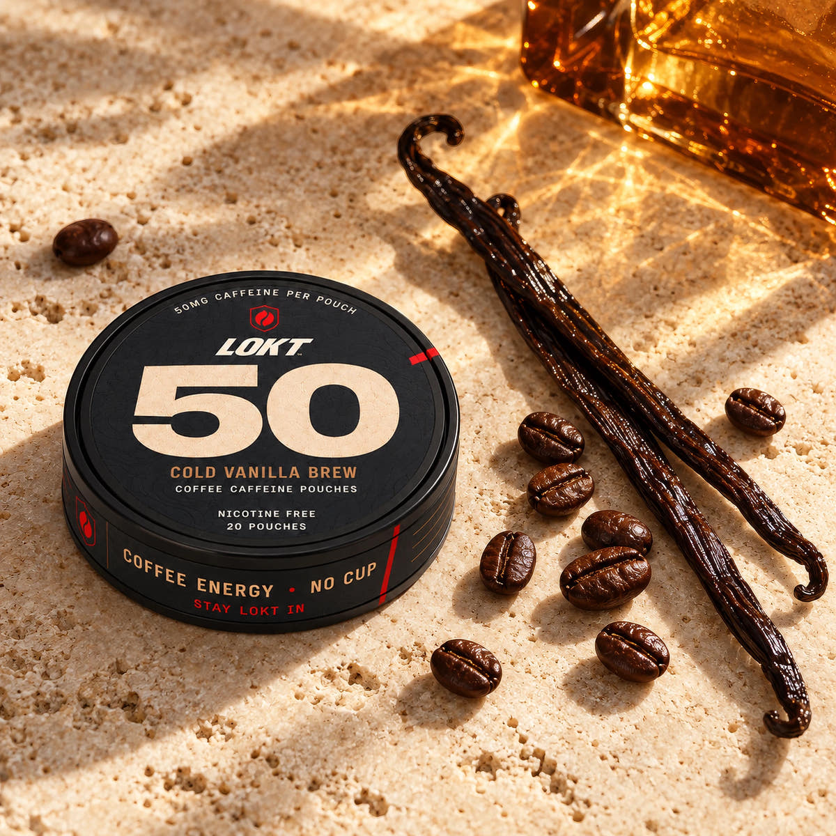 Cold Vanilla Brew with vanilla pods, coffee beans and amber light on warm stone.