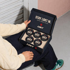 A compact LOKT box holds five closed Dark Espresso tins, with Stay LOKT In printed inside the lid.