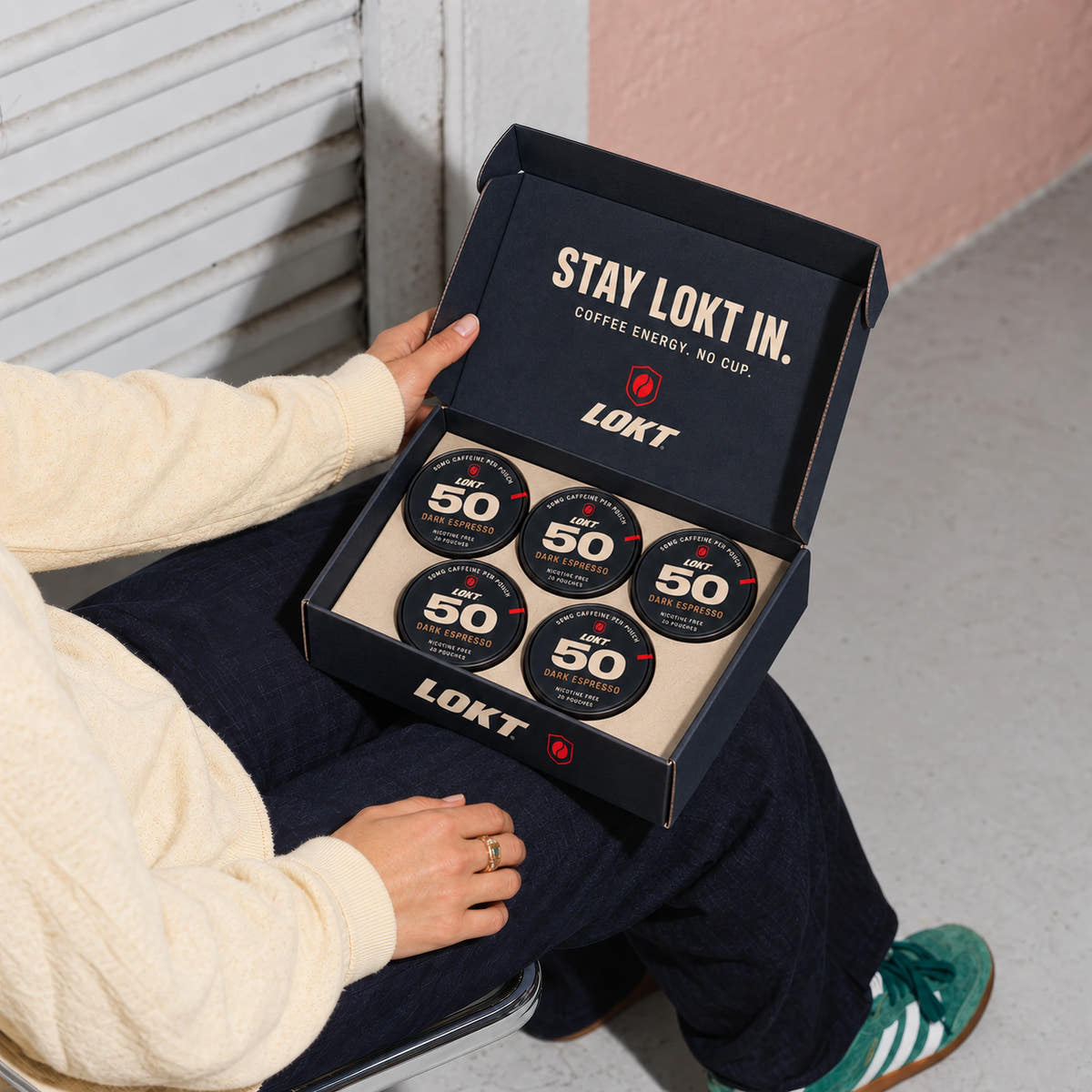 A compact LOKT box holds five closed Dark Espresso tins, with Stay LOKT In printed inside the lid.