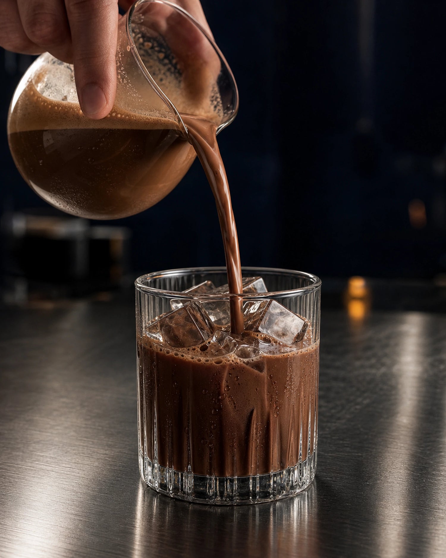 LOKT READY Dark Mocha being poured over ice in a tall glass